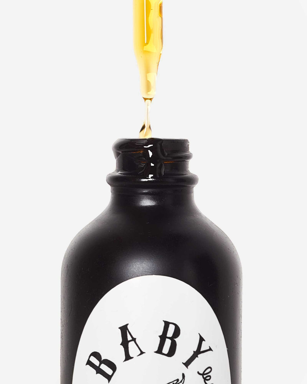 Image showing a filled dropper being removed from the bottle
