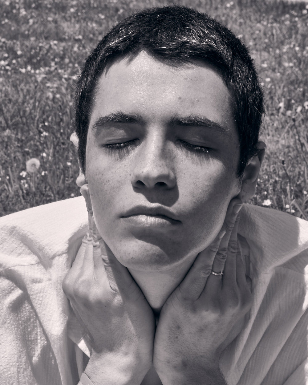 Face of a young woman showing her smooth skin in the sunlight.