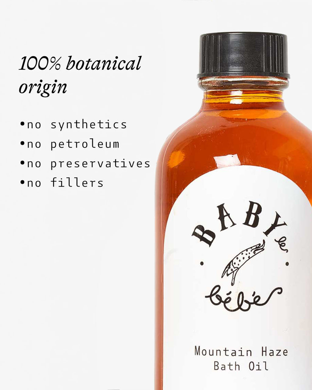 Bottle of Mountain Haze bath oil with a list of benefits. 100% botanical origin. no synthetics, no petroleum, no preservatives, no fillers. 